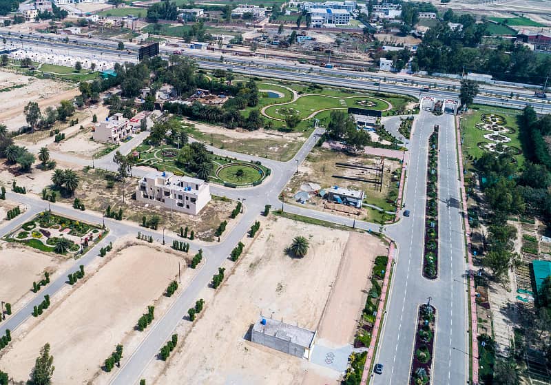 7.15 Marla Facing Park Plot for Sale in C Block Palm City Lahore 18