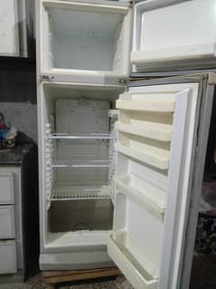 "Stay cool and comfortable! Dawnlance refrigerator with wooden stool. "