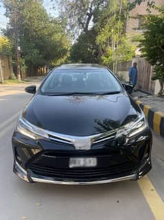 Toyota Corolla black x avaliable for rent in pakpattan and arifwala