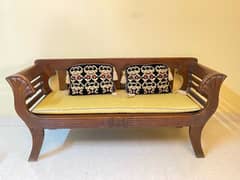 2 seater wooden sofa with cushions for sale 0