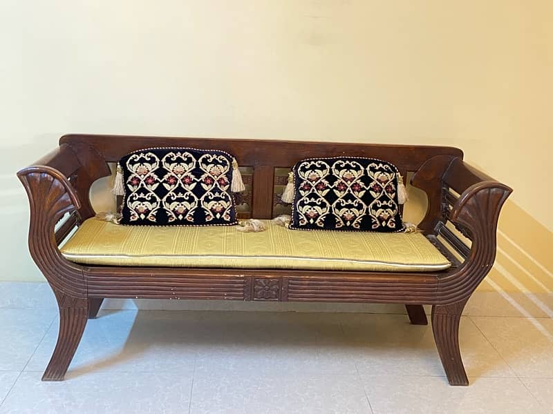 2 seater wooden sofa with cushions for sale 1