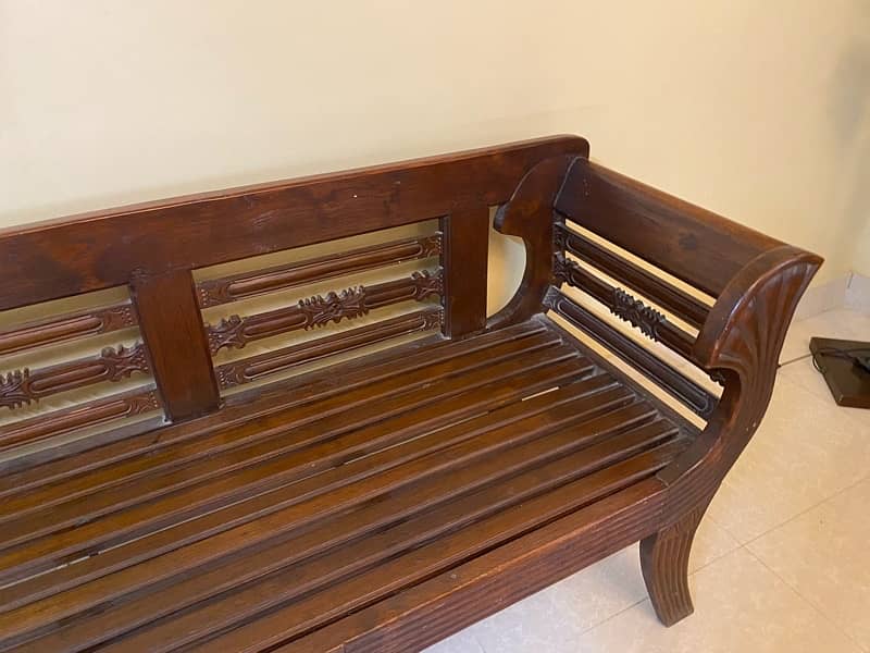 2 seater wooden sofa with cushions for sale 5