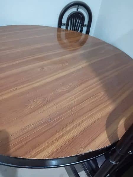 dining table with 6 chairs very less used . new condition 1
