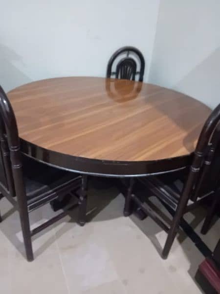 dining table with 6 chairs very less used . new condition 2