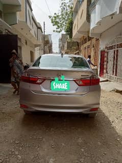 I am selling my car Honda Grace hybrid 2015 registration 2018 in Sindh
