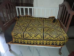 1 baby cot beds with mattress made of sheesham , used in guest room