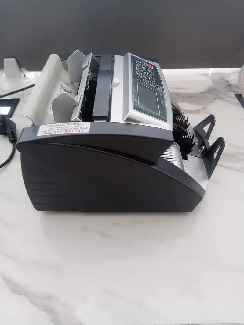 NEWWAVE MODERN SOLUTIONS CASH COUNTING MACHINE 1