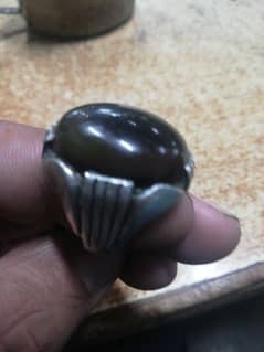 silver ring with brown gem stone