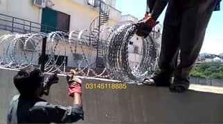 Khawaja:Chainlink Mesh Fence, Concertina Barbed Razor Wire
