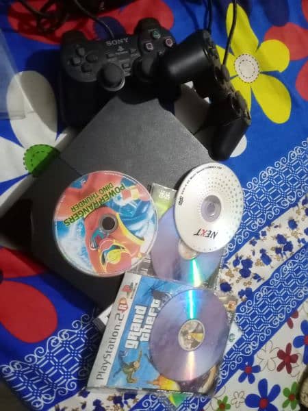 PS2 With Controllers and DVD Games 6
