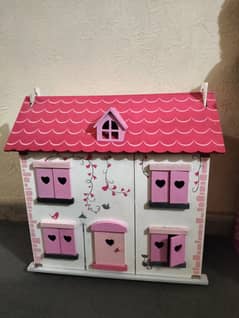 A wooden doll house
