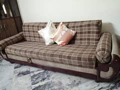 sofa cum bed set and table