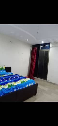 Room with washroom with double bed and mattress ceiling fan for rent