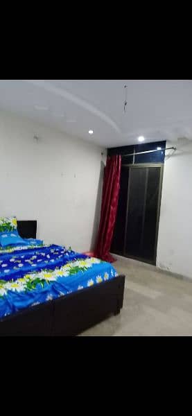 Room with washroom with double bed and mattress ceiling fan for rent 0