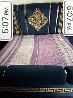 bed set with curtains, two coffee chairs and table