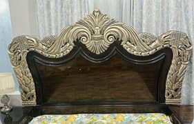 Royal style wooden bed set includes bed, side table, dressing table.