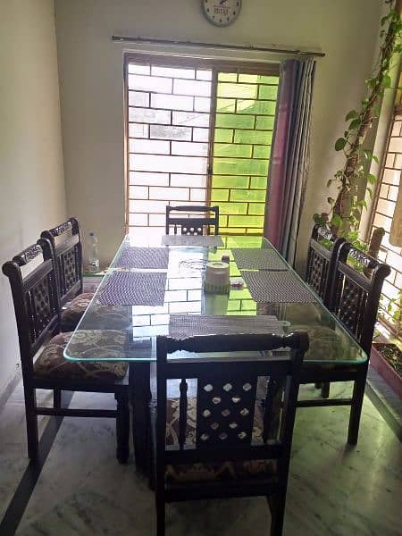 six seater dining table with glass top in very good condition 3