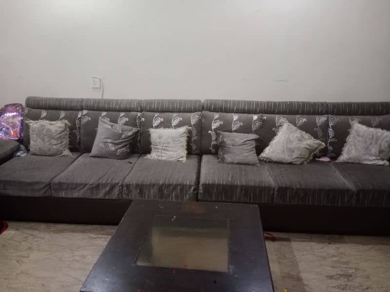 L shape sofa with centre table   10 by 10 condition 2