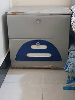 single beds cupboard and side table