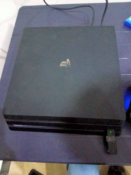 ps 4 pro 1 TB with two controllers and 7 games 0