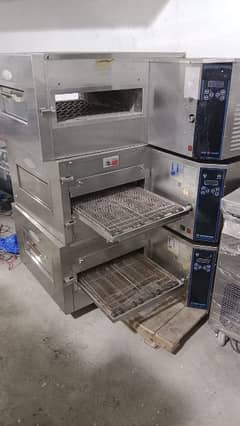 pizza oven//shawarma counters// prep table// fryer// pizza box// pans