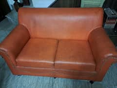 2 seater orange color leather sofa