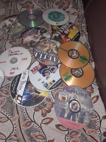 play station 2 with CDs,controller,memory card and wires 2
