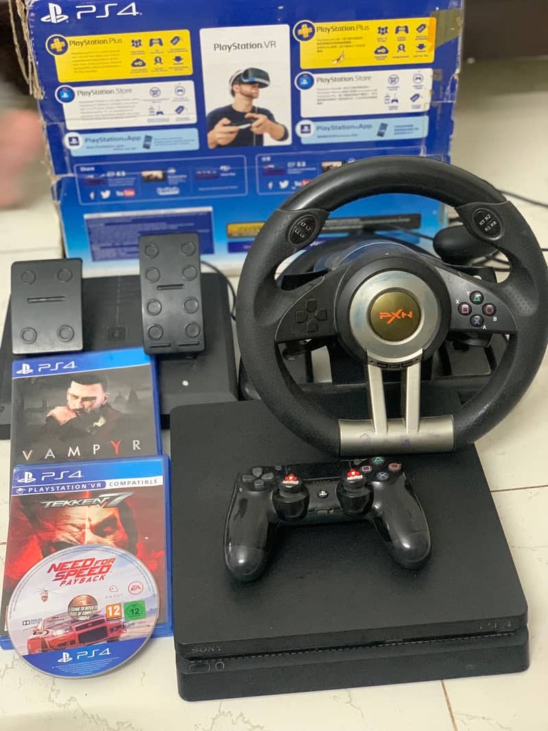 Ps4 slim 500 gb slim, PXN stearing wheel ,2 controller and 4 games 1