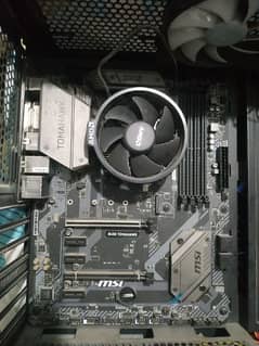 MSI B450 Tomahawk with AMD Wraith CPU Cooler Box