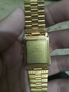 Western 23 k gold plated watch. 0