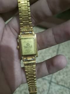 swistar 22 k gold plated watch.