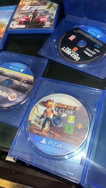 PS4 SLIM 1TB with 8 cd and staring wheel 5