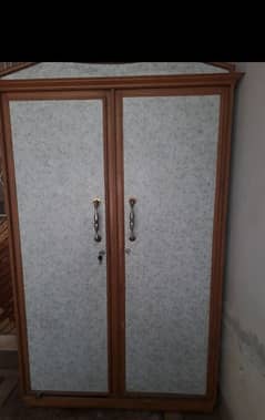 two sides of a wardrobe with heavy wood and with locks