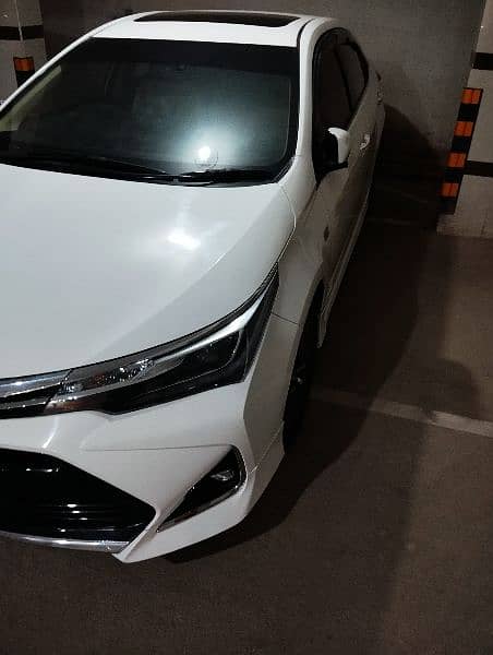 Toyota Corolla Altis Grande Model 2021 White Low Mileage 1