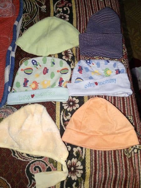 new born baby dresses caps  etc for sell. . used just for one month 1