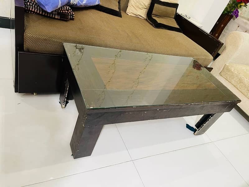 wooden table with glass on top 3