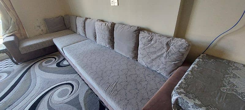 L shaped grey sofa 1