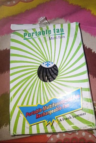 Mini rechargeable Fan with USB charging Cable. 1
