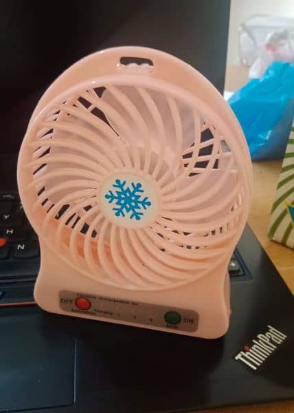 Mini rechargeable Fan with USB charging Cable. 4