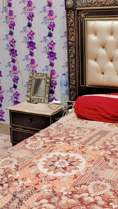 A King Size bed 2 side tables and Dressing