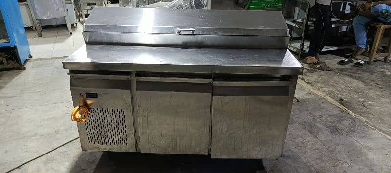 pizza oven south star, dough mixer, prep table, delivery bags, fryer 1