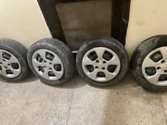 14 inch original tyres with rims of Kia picanto (MT) for sale.