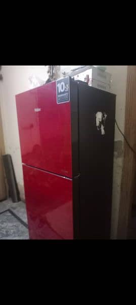 fridge in red or grey colour with 2 doors and garenty 0