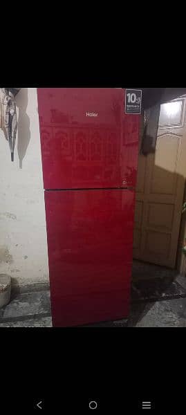 fridge in red or grey colour with 2 doors and garenty 7