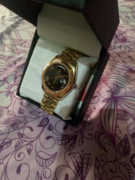 A branded. roylax watch gold color 1