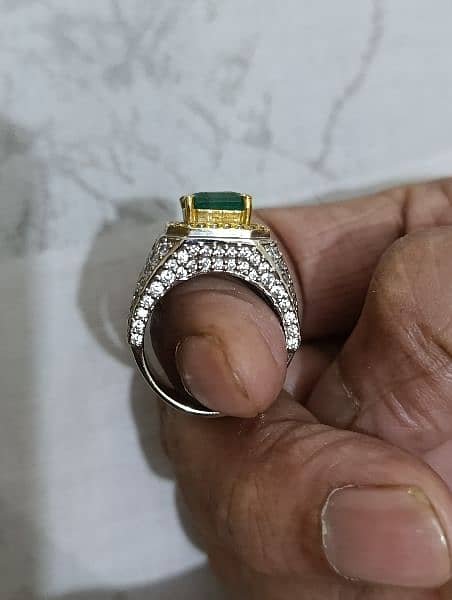 Top quality emerald in a heavy hand made crafted ring. Lab certified 5