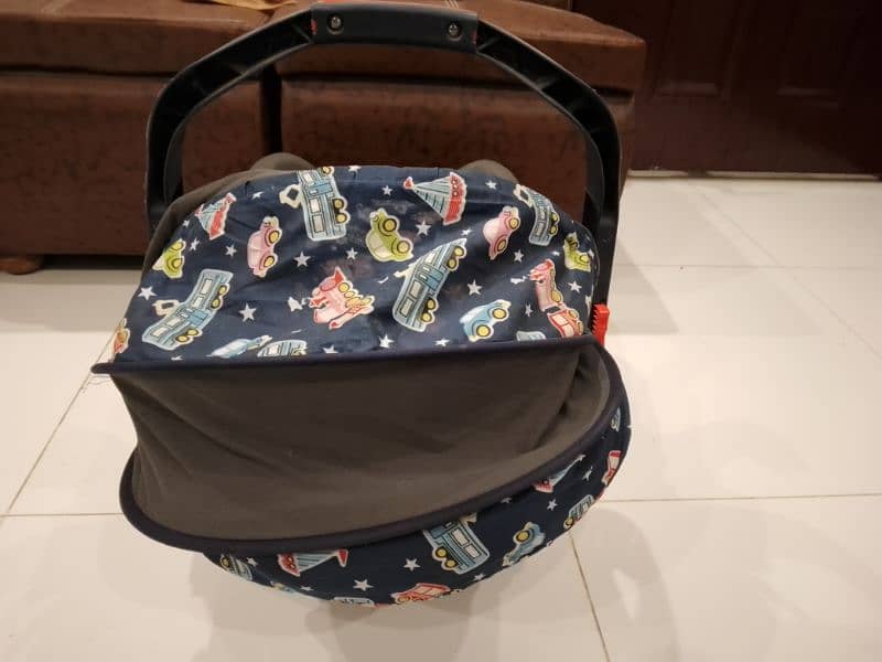 carry cot in good condition 2