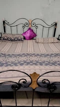 Rod iron double bed with side tables and mirror in good condition