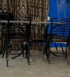 rod black color dinning table with 4 chairs
