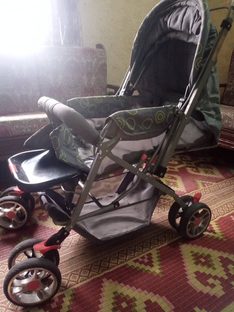 A baby caring wheel chair 2
